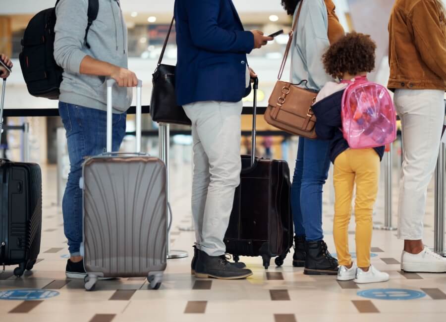 people waiting in line at the airport